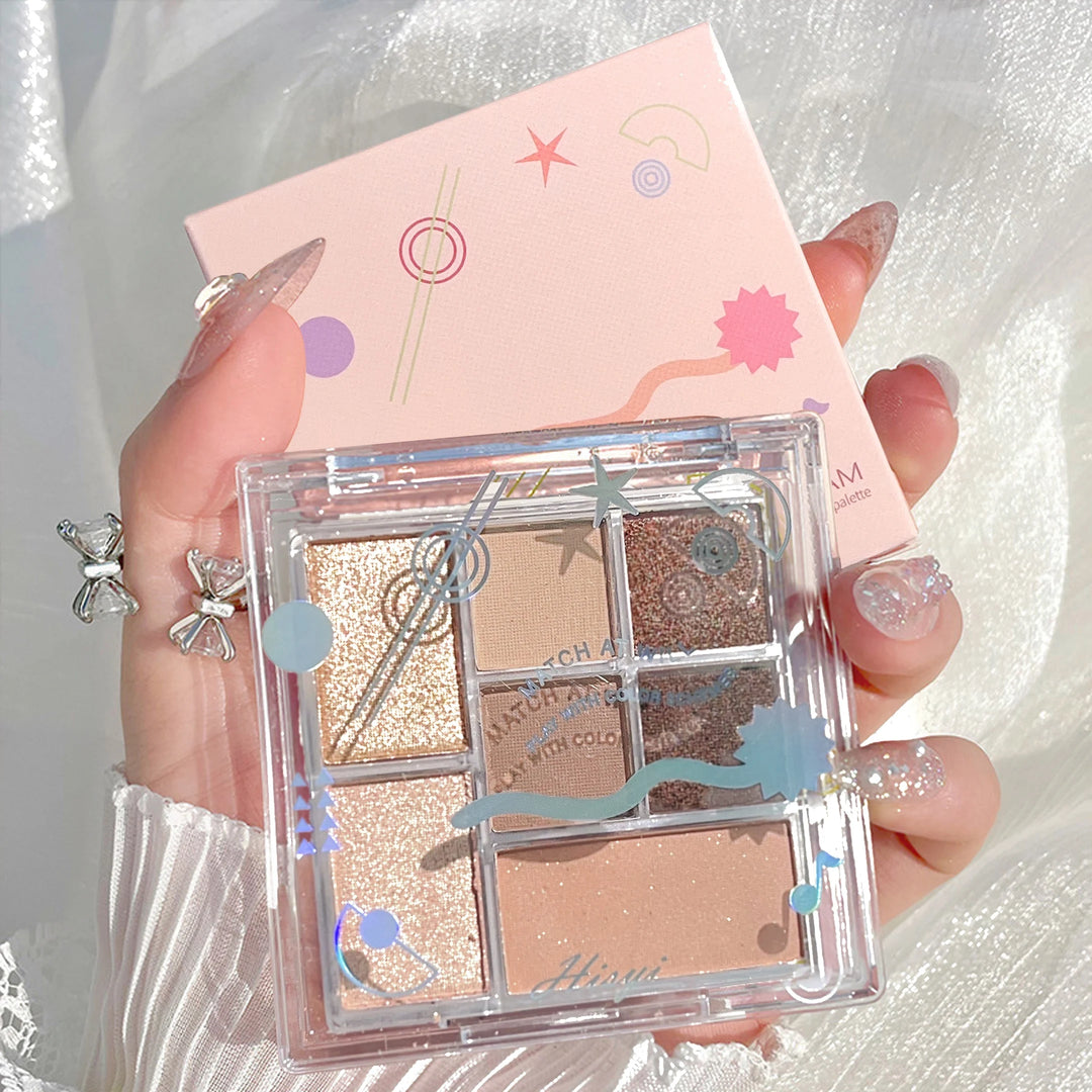 Seven-color eyeshadow palette in earth tones with shimmer, glitter, matte, and pearl finishes, waterproof, and playful