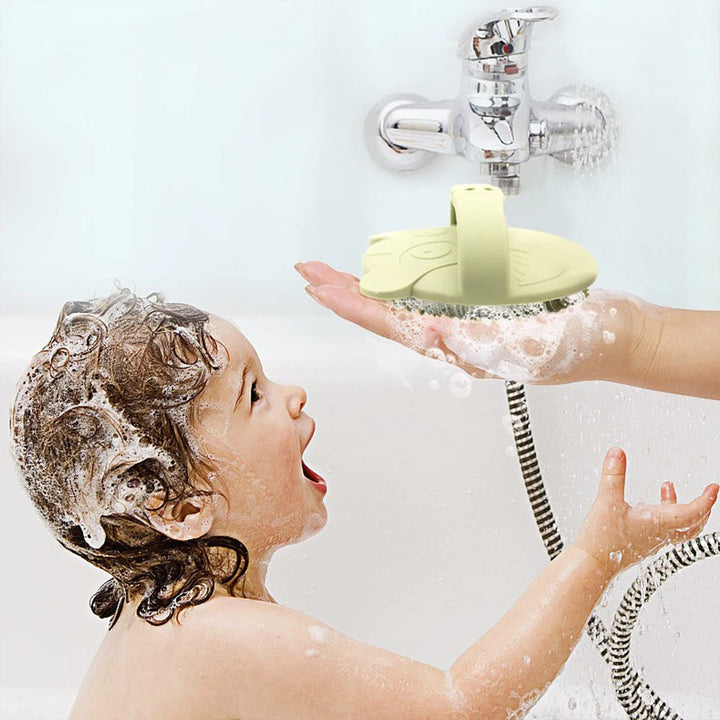 Soft silicone baby bath brush gently cleans baby's hair and body, BPA-free, a safe bathing tool for newborns and children.